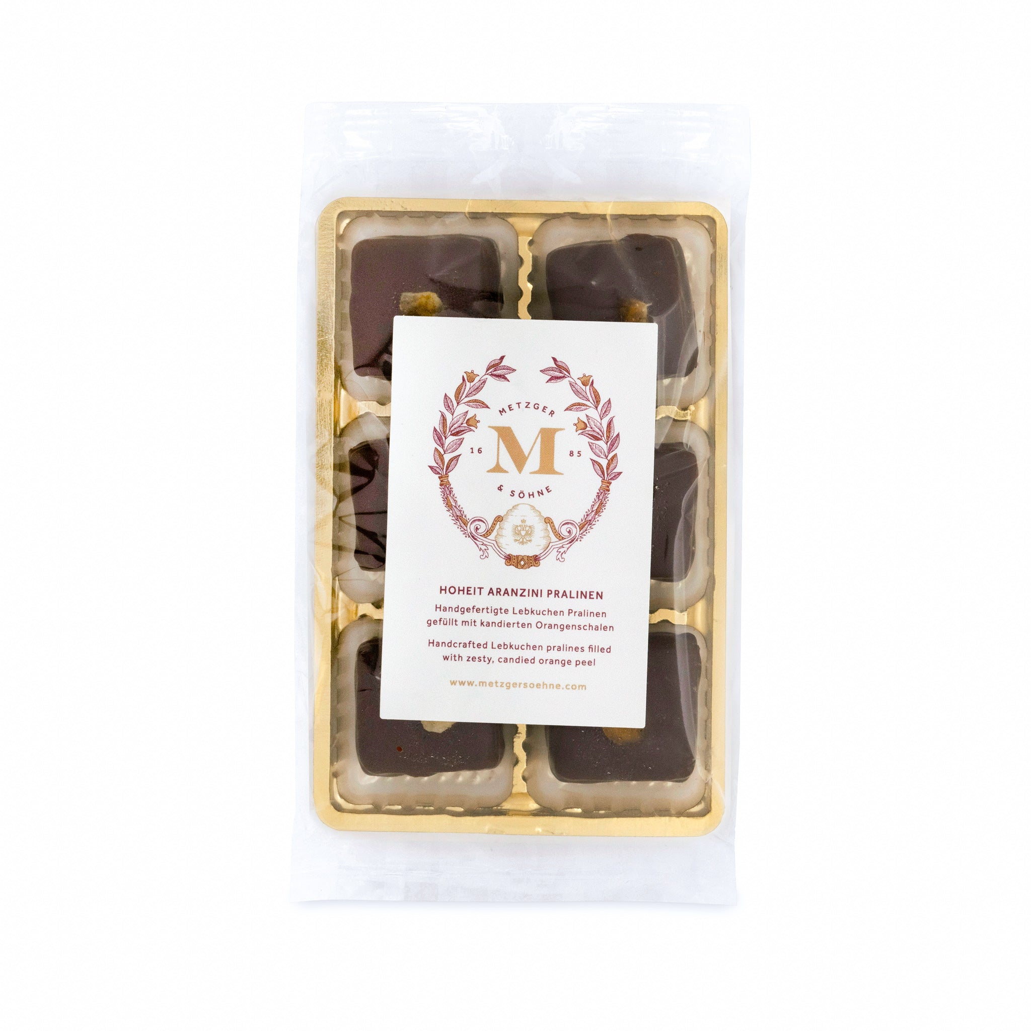 6 handcrafted Lebkuchen 'honey cake' pralines, filled with candied orange peel, and coated in rich, dark chocolate. The perfect treat for those who appreciate the romance of chocolate and orange.