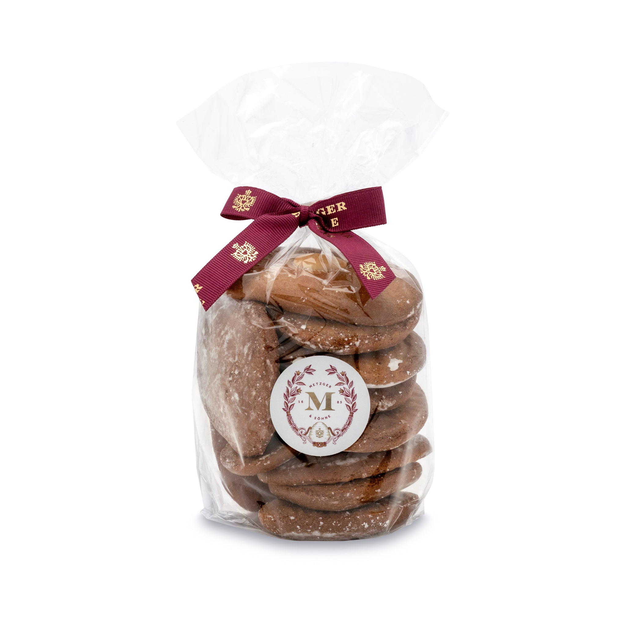 Our Honey Lebkuchen is our signature House Lebkuchen that forms the basis of all our specialities. Metzger Lebkuchen is Viennese gingerbread with a soft texture and subtle taste. The honey dough is refined with spices, topped with almonds and glazed with sugar after baking. House Lebkuchen is a true Viennese staple at the Christmas table.