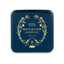 Load image into Gallery viewer, Metzger signature tin in navy blue filled with 9 different Lebkuchen 'honey cake' pralines filled with marzipan, fruits, nuts or jelly, encased in chocolate.