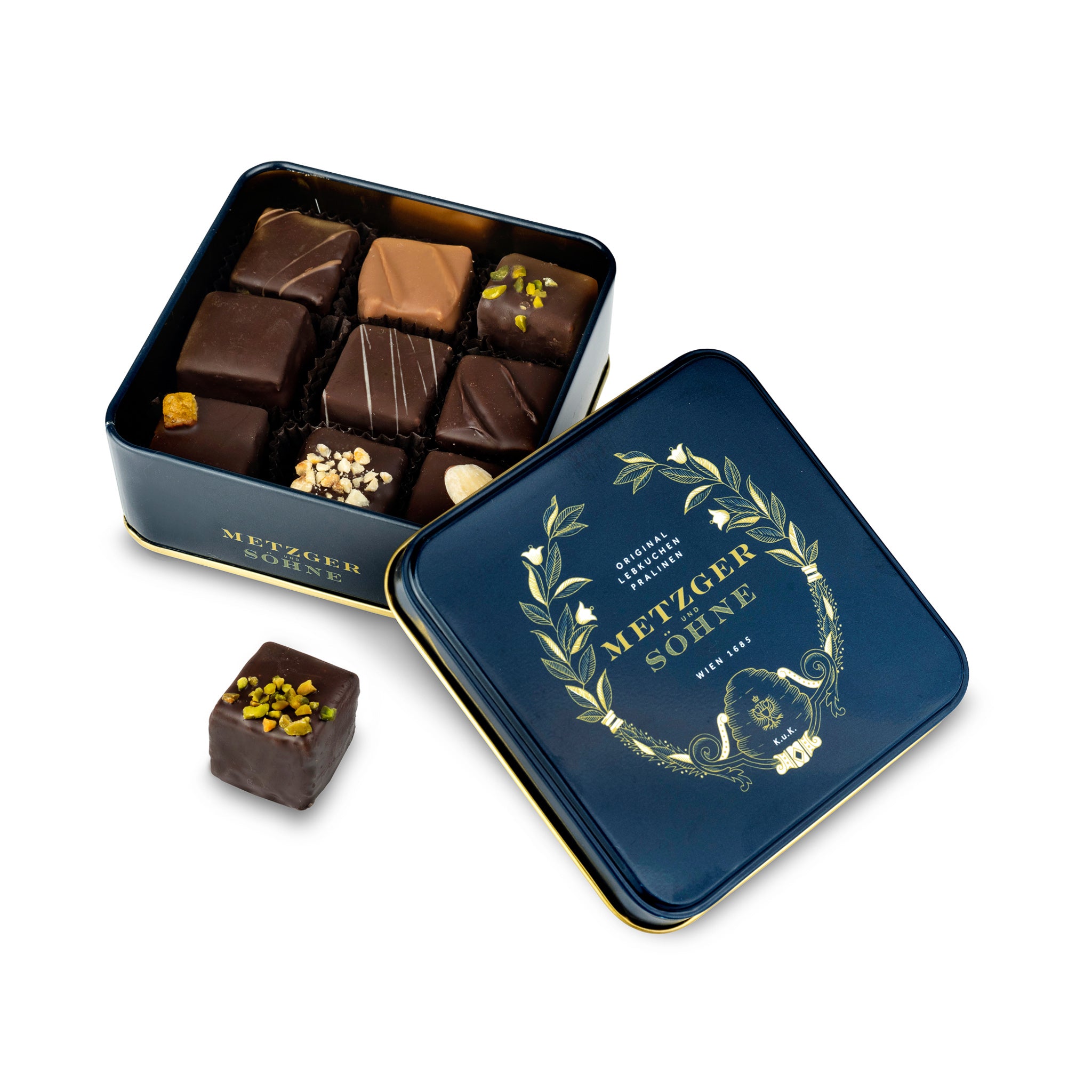 Metzger signature tin in navy blue filled with 9 different Lebkuchen 'honey cake' pralines filled with marzipan, fruits, nuts or jelly, encased in chocolate.