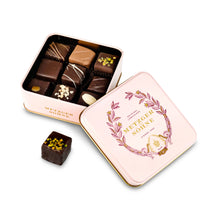 Load image into Gallery viewer, A perfect gift for a special occasion. Metzger's signature luxury tin in delicate pink, filled with with 9 delectable Lebkuchen chocolate pralines. Each praline is layered with Lebkuchen 'honey cake' and filled with marzipan, nuts or fruit jams and jellies, encased in rich chocolate. Suitable for vegetarians.