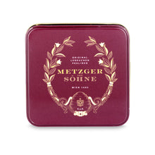 Load image into Gallery viewer, A perfect gift for a special occasion. Metzger's signature luxury tin in opulent red, filled with with 9 delectable Lebkuchen chocolate pralines. Each praline is layered with Lebkuchen 'honey cake' and filled with marzipan, nuts or fruit jams and jellies, encased in rich chocolate. Suitable for vegetarians.