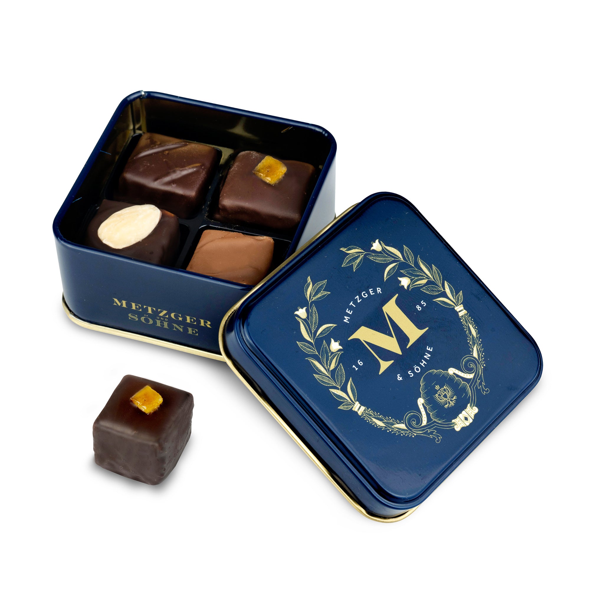 Petit Metzger signature tin in blue filled with 4 different Lebkuchen 'honey cake' pralines.