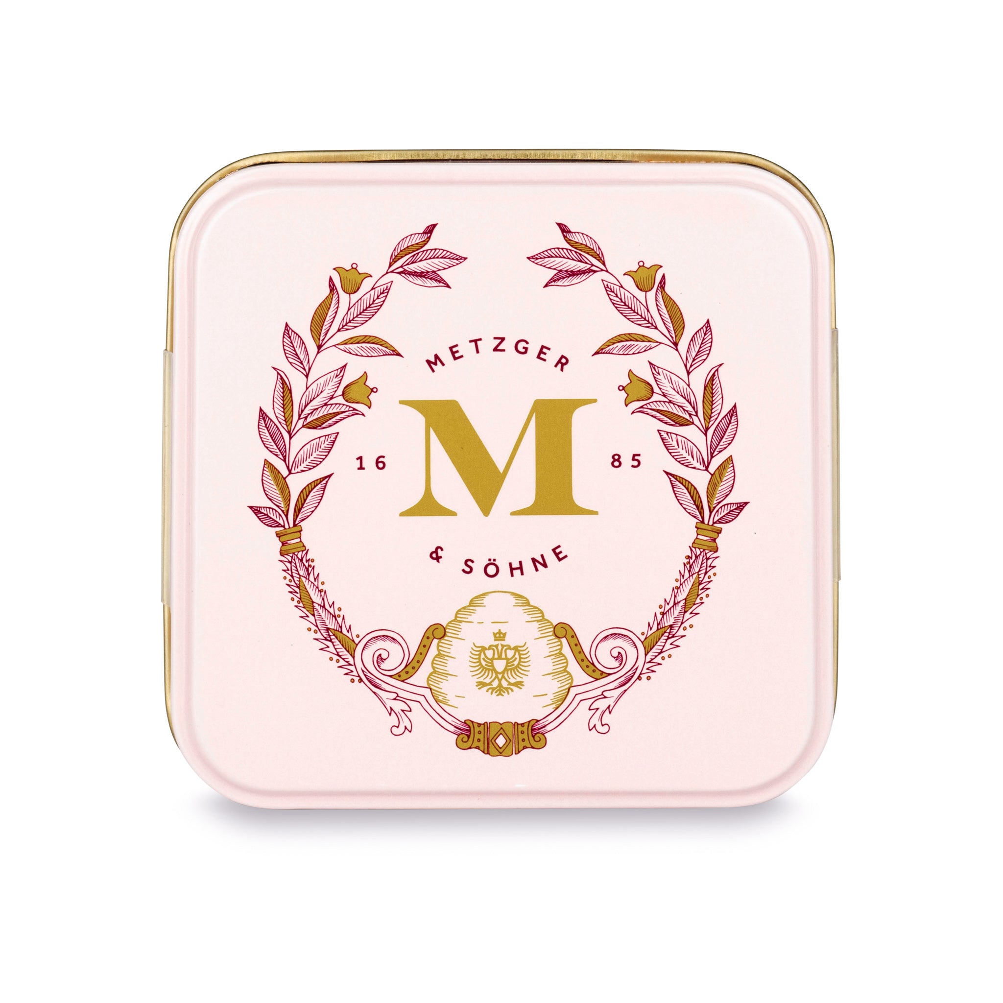 Petit Metzger signature tin in pastel pink filled with 4 different Lebkuchen 'honey cake' pralines.