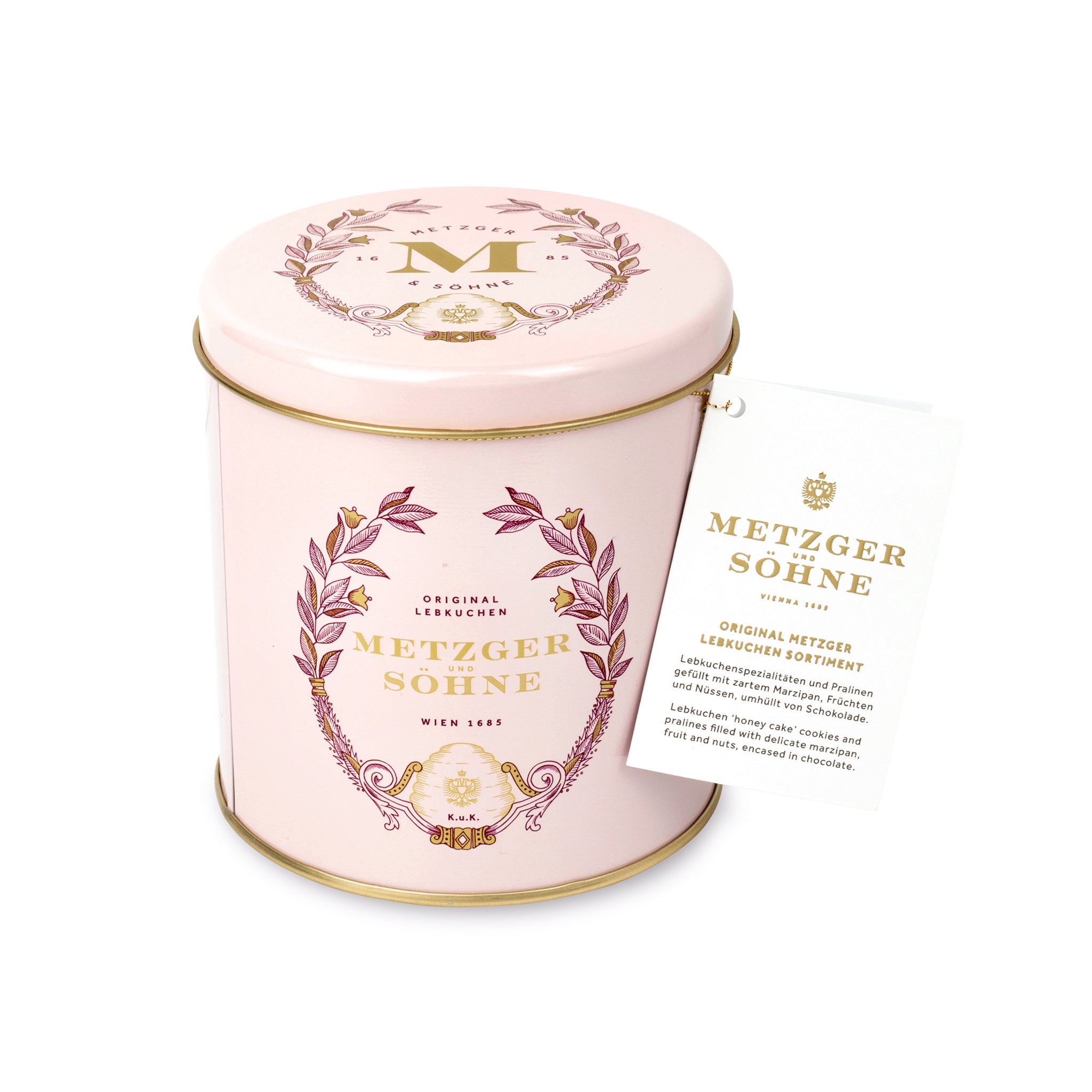Luxury Metzger gift tin in pink, filled with our popular Lebkuchen cookies and chocolate pralines. There are 10 opulent praline types, from marzipan mixes to fruit jellies, jams and nut fillings, coated in chocolate. The Lebkuchen cookies include our fruit bread with dried fruits and nuts, basler with a cherry undertone, chocolate robbins, signature house Lebkuchen and Aranzini Lebkuchen minis. A perfect Lebkuchen taster gift or selection for the Christmas table.