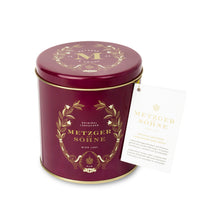 Load image into Gallery viewer, Luxury Metzger gift tin in red, filled with our popular Lebkuchen cookies and chocolate pralines. There are 10 opulent praline types, from marzipan mixes to fruit jellies, jams and nut fillings, coated in chocolate. The Lebkuchen cookies include our fruit bread with dried fruits and nuts, basler with a cherry undertone, chocolate robbins, signature house Lebkuchen and Aranzini Lebkuchen minis. A perfect Lebkuchen taster gift or selection for the Christmas table.