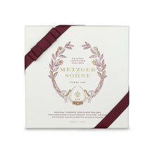 Load image into Gallery viewer, A perfect gift for a special occasion. Metzger's signature luxury box in ice white, filled with with 16 delectable Lebkuchen chocolate pralines. Each praline is layered with Lebkuchen 'honey cake' and filled with marzipan, nuts or fruit jams and jellies, encased in rich chocolate. Suitable for vegetarians.