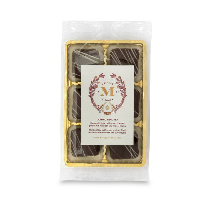 6 handcrafted Lebkuchen 'honey cake' pralines filled with opulent currant jelly and marzipan, enrobed in dark chocolate and topped with white chocolate. The high quality chocolate couvertures enchant with an indulgent flavour, perfectly complimenting our Lebkuchen.