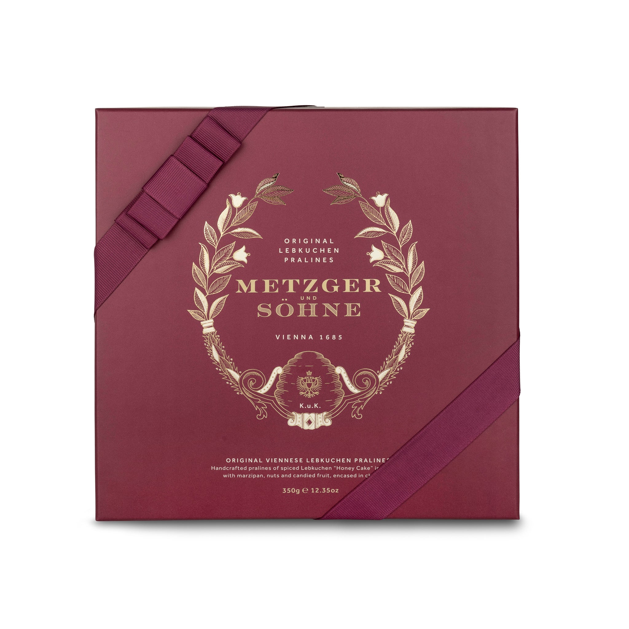 A perfect gift for a special occasion. Metzger's signature luxury box in opulent red, filled with with 25 delectable Lebkuchen chocolate pralines. Each praline is layered with Lebkuchen 'honey cake' and filled with marzipan, nuts or fruit jams and jellies, encased in rich chocolate. Suitable for vegetarians.
