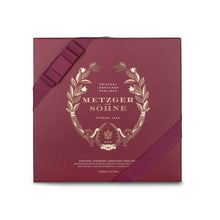 Load image into Gallery viewer, A perfect gift for a special occasion. Metzger&#39;s signature luxury box in opulent red, filled with with 25 delectable Lebkuchen chocolate pralines. Each praline is layered with Lebkuchen &#39;honey cake&#39; and filled with marzipan, nuts or fruit jams and jellies, encased in rich chocolate. Suitable for vegetarians.