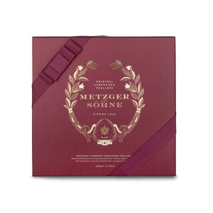 A perfect gift for a special occasion. Metzger's signature luxury box in opulent red, filled with with 25 delectable Lebkuchen chocolate pralines. Each praline is layered with Lebkuchen 'honey cake' and filled with marzipan, nuts or fruit jams and jellies, encased in rich chocolate. Suitable for vegetarians.