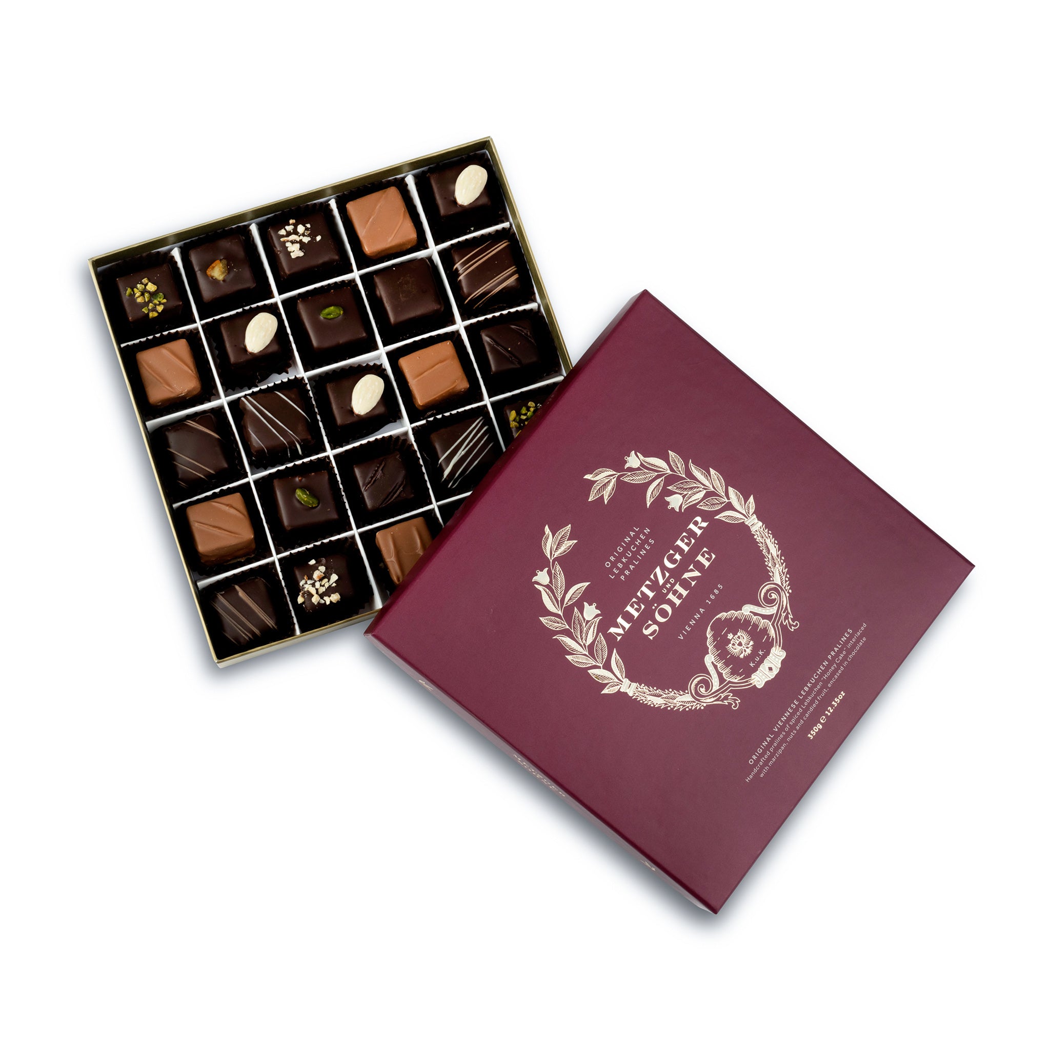 A perfect gift for a special occasion. Metzger's signature luxury box in opulent red, filled with with 25 delectable Lebkuchen chocolate pralines. Each praline is layered with Lebkuchen 'honey cake' and filled with marzipan, nuts or fruit jams and jellies, encased in rich chocolate. Suitable for vegetarians.
