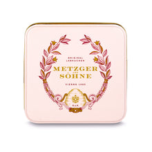 Load image into Gallery viewer, A perfect gift for a special occasion. Metzger&#39;s signature luxury tin in delicate pink, filled with with 9 delectable Lebkuchen chocolate pralines. Each praline is layered with Lebkuchen &#39;honey cake&#39; and filled with marzipan, nuts or fruit jams and jellies, encased in rich chocolate. Suitable for vegetarians.
