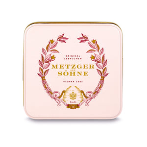 A perfect gift for a special occasion. Metzger's signature luxury tin in delicate pink, filled with with 9 delectable Lebkuchen chocolate pralines. Each praline is layered with Lebkuchen 'honey cake' and filled with marzipan, nuts or fruit jams and jellies, encased in rich chocolate. Suitable for vegetarians.