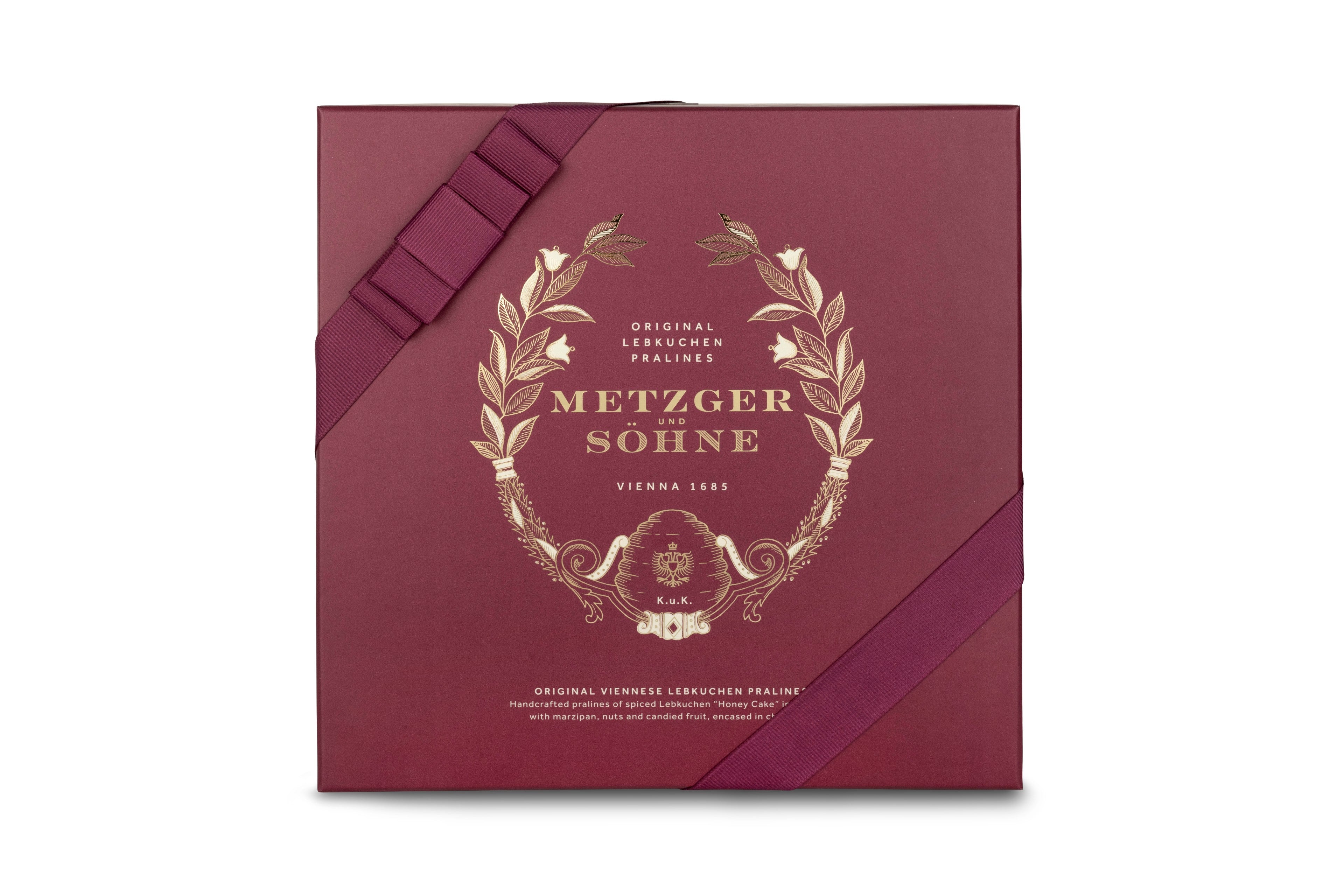 A perfect gift for a special occasion. Metzger's signature luxury box in opulent red, filled with with 50 delectable Lebkuchen chocolate pralines. Each praline is layered with Lebkuchen 'honey cake' and filled with marzipan, nuts or fruit jams and jellies, encased in rich chocolate. Suitable for vegetarians.