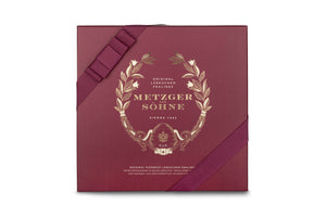 A perfect gift for a special occasion. Metzger's signature luxury box in opulent red, filled with with 50 delectable Lebkuchen chocolate pralines. Each praline is layered with Lebkuchen 'honey cake' and filled with marzipan, nuts or fruit jams and jellies, encased in rich chocolate. Suitable for vegetarians.