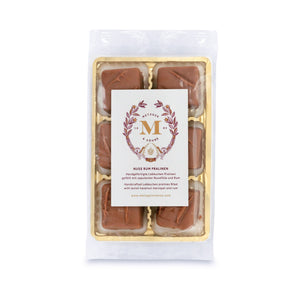6 handcrafted Lebkuchen 'honey cake' pralines filled with opulent hazelnut marzipan and rum, coated in delicate milk chocolate. A delicious taste of Christmas in every bite.