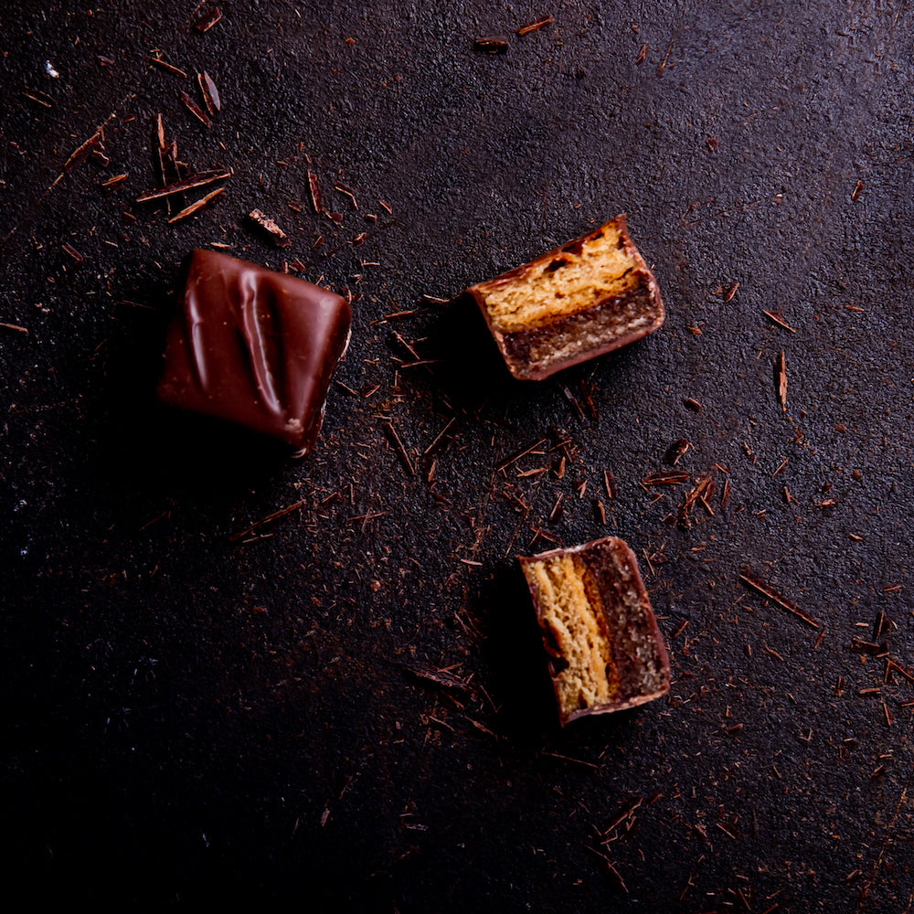 6 handcrafted Lebkuchen 'honey cake' pralines filled with opulent hazelnut marzipan and rum, coated in delicate milk chocolate. A delicious taste of Christmas in every bite. 