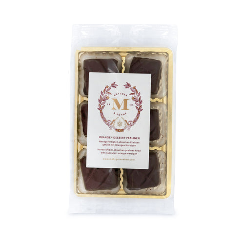 6 handcrafted Lebkuchen 'honey cake' pralines filled with delicate orange marzipan and coated in rich, dark chocolate. A little taste of christmas in every bite. The high quality chocolate couvertures enchant with an intense chocolate taste to compliment our Lebkuchen and opulent marzipan filling. Our chocolate is made with cocoa butter and refined with natural Bourbon vanilla, free of external fats.