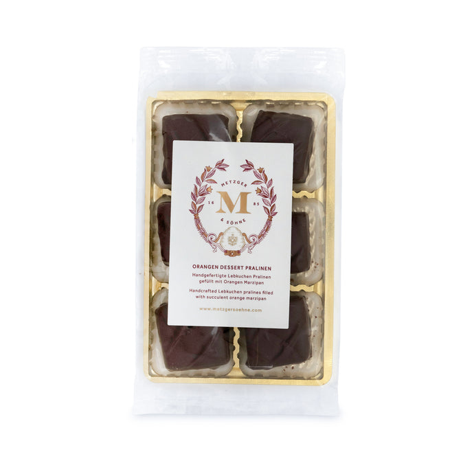 6 handcrafted Lebkuchen 'honey cake' pralines filled with delicate orange marzipan and coated in rich, dark chocolate. A little taste of christmas in every bite. The high quality chocolate couvertures enchant with an intense chocolate taste to compliment our Lebkuchen and opulent marzipan filling. Our chocolate is made with cocoa butter and refined with natural Bourbon vanilla, free of external fats.