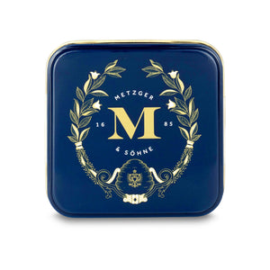 Petit Metzger signature tin in blue filled with 4 different Lebkuchen 'honey cake' pralines.