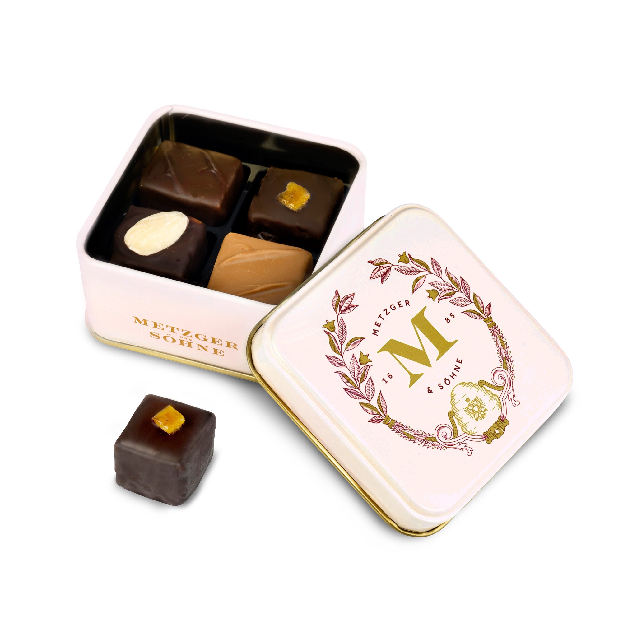 Petit Metzger signature tin in pastel pink filled with 4 different Lebkuchen 'honey cake' pralines.