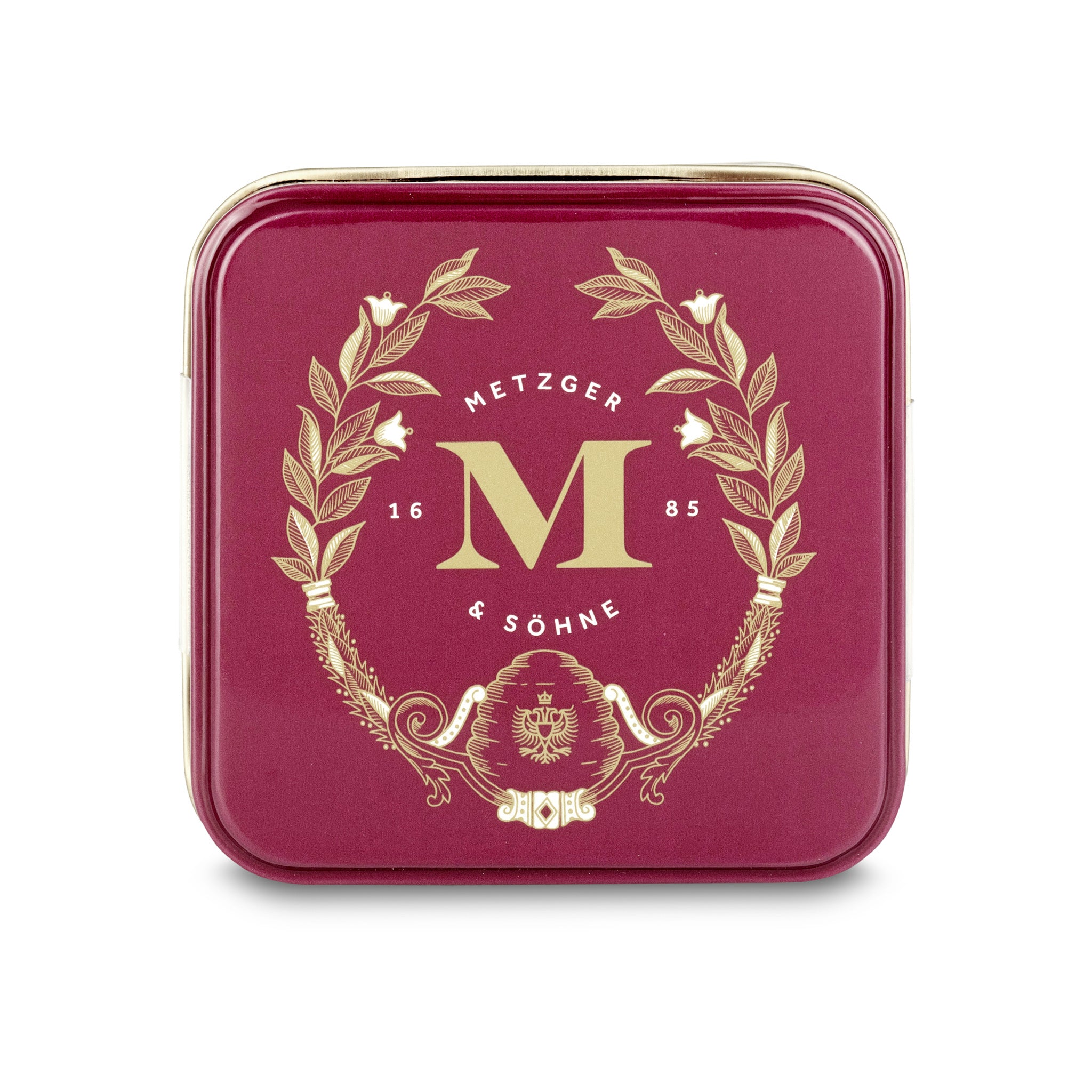 Petit Metzger signature tin in red filled with 4 different Lebkuchen 'honey cake' pralines.