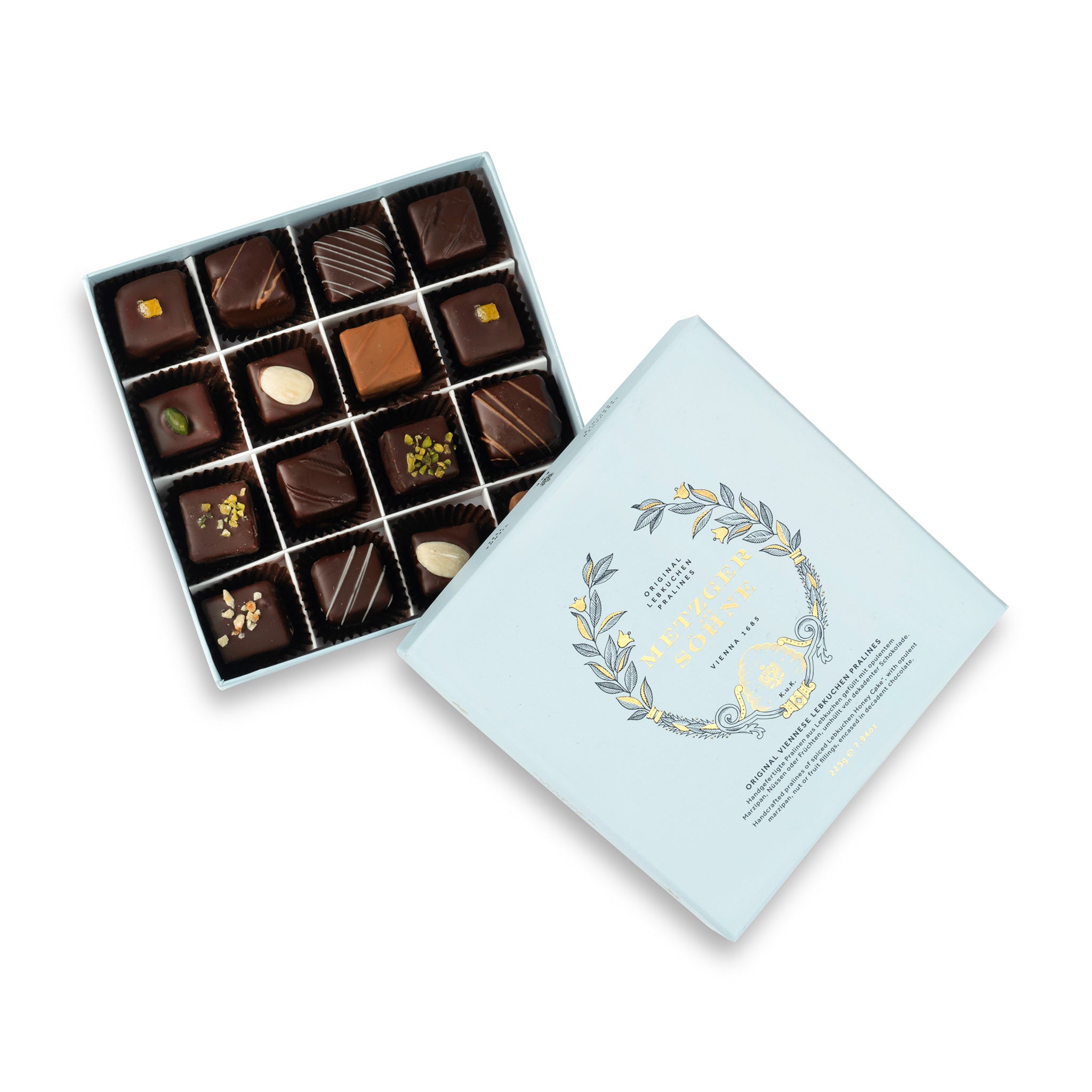 A perfect gift for a special occasion. Metzger's signature luxury box in ice blue, filled with with 16 delectable Lebkuchen chocolate pralines. Each praline is layered with Lebkuchen 'honey cake' and filled with marzipan, nuts or fruit jams and jellies, encased in rich chocolate. Suitable for vegetarians.