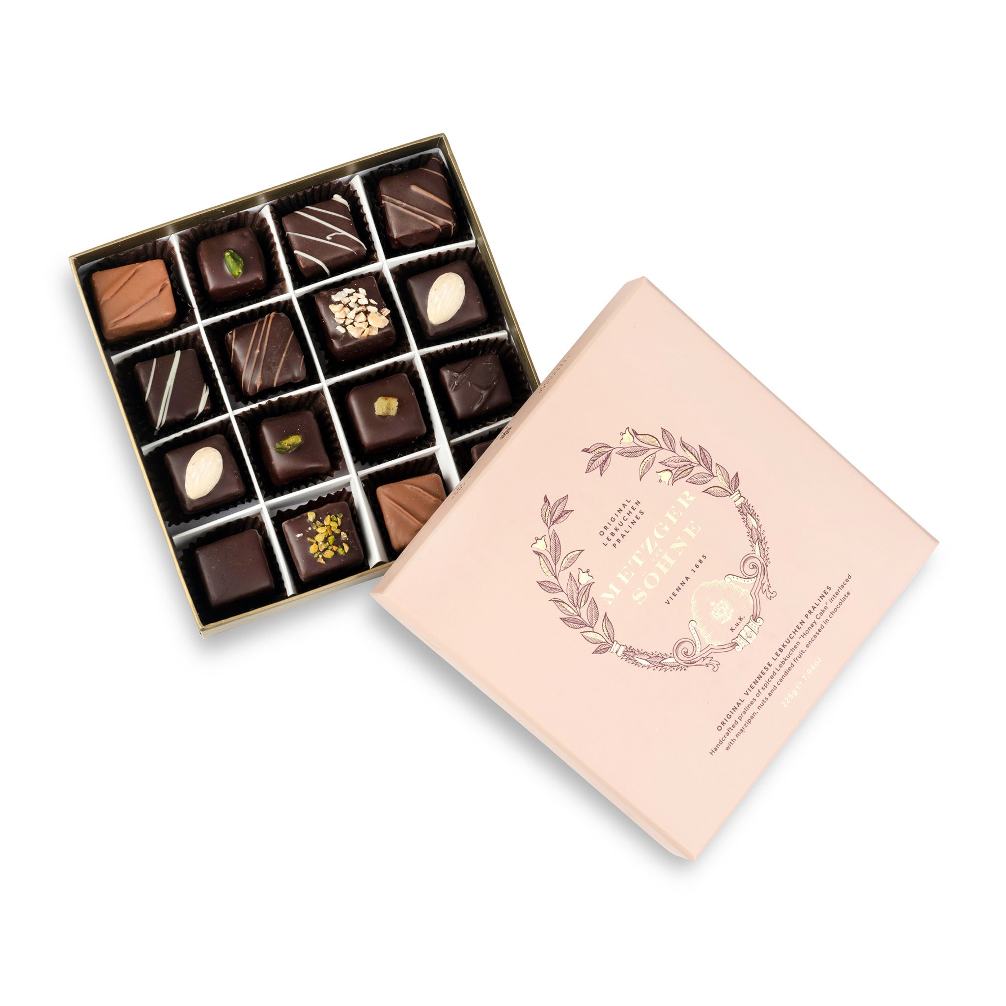 A perfect gift for a special occasion. Metzger's signature luxury box in delicate pink, filled with with 16 delectable Lebkuchen chocolate pralines. Each praline is layered with Lebkuchen 'honey cake' and filled with marzipan, nuts or fruit jams and jellies, encased in rich chocolate. Suitable for vegetarians.