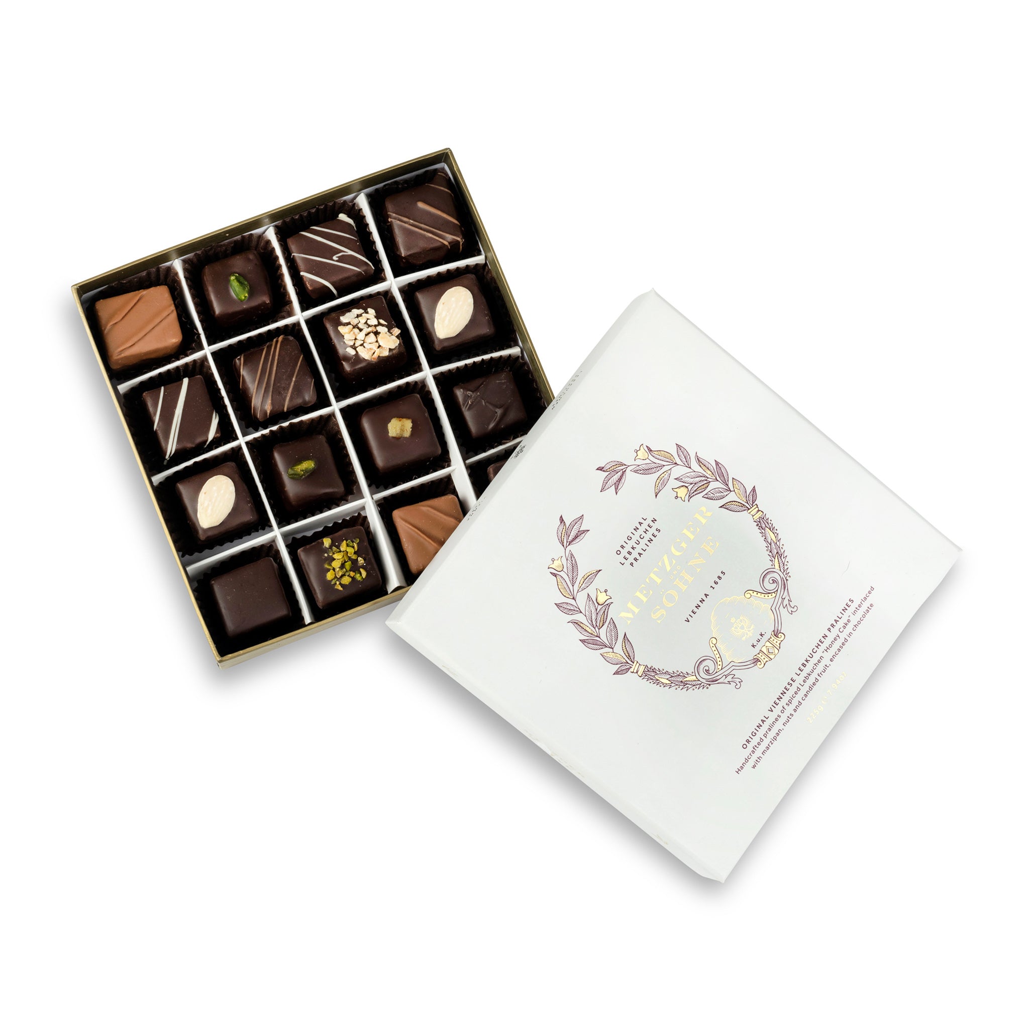 A perfect gift for a special occasion. Metzger's signature luxury box in ice white, filled with with 16 delectable Lebkuchen chocolate pralines. Each praline is layered with Lebkuchen 'honey cake' and filled with marzipan, nuts or fruit jams and jellies, encased in rich chocolate. Suitable for vegetarians.